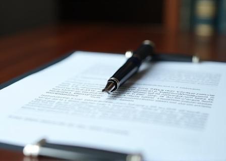 Legal document with a classic fountain pen on a desk